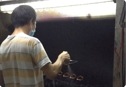 sunglasses manufacturers spraying.jpg